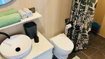 Shower, eco-friendly toiletries, towels, soap