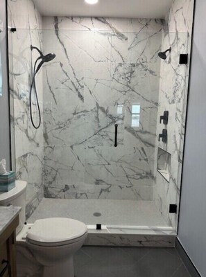 Shower, hair dryer, towels, soap