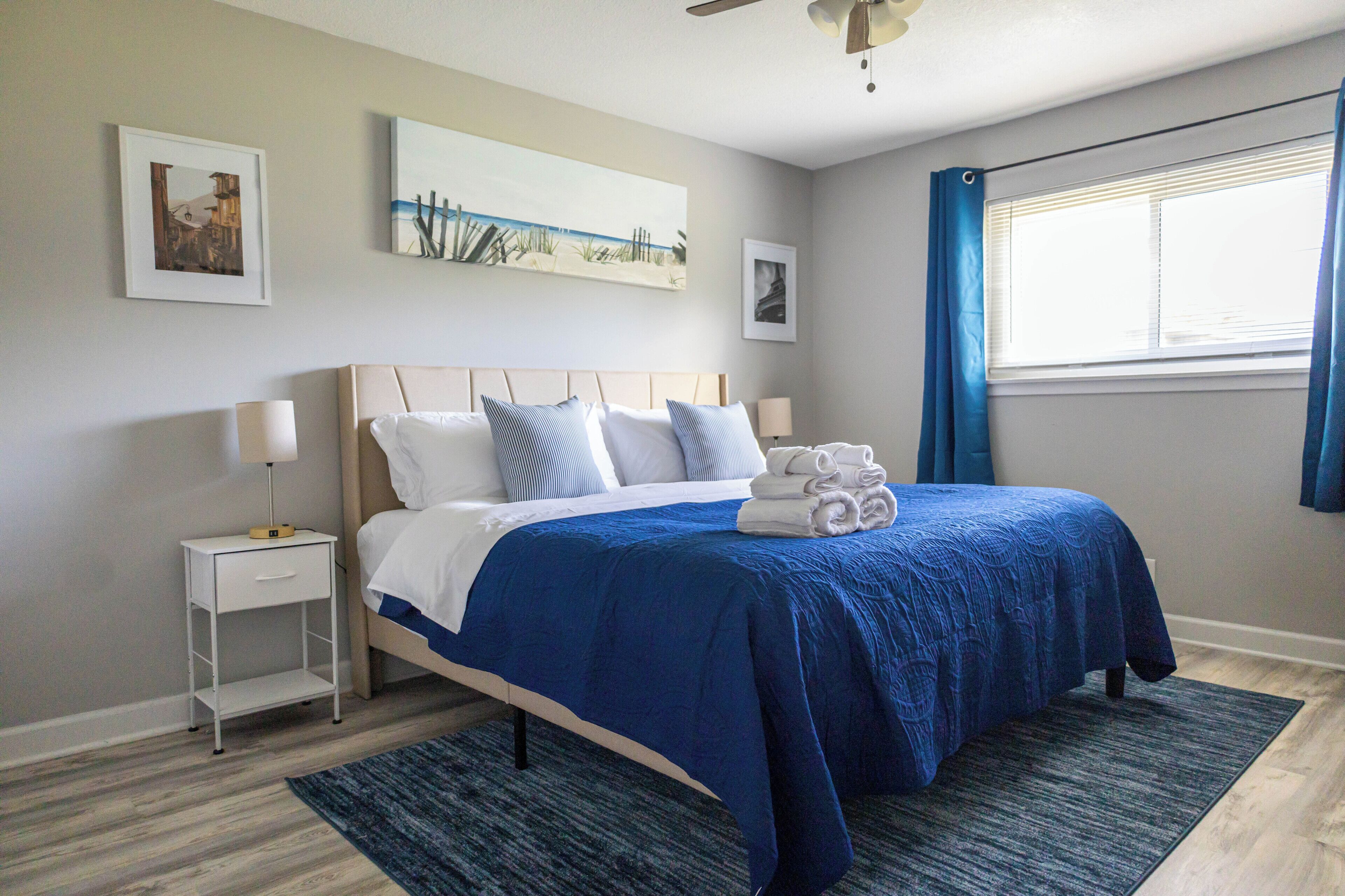 A charming bedroom with a king bed in quiet Shawnee neighborhood near highways.