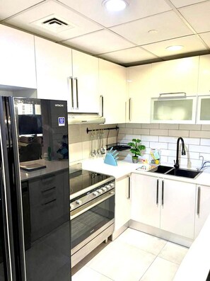 Apartment | Private kitchen | Fridge, microwave, oven, stovetop