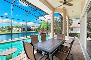 Outdoor dining - This waterfront home on Marco Island is the perfect vacation destination for families or groups. (Marco Island)