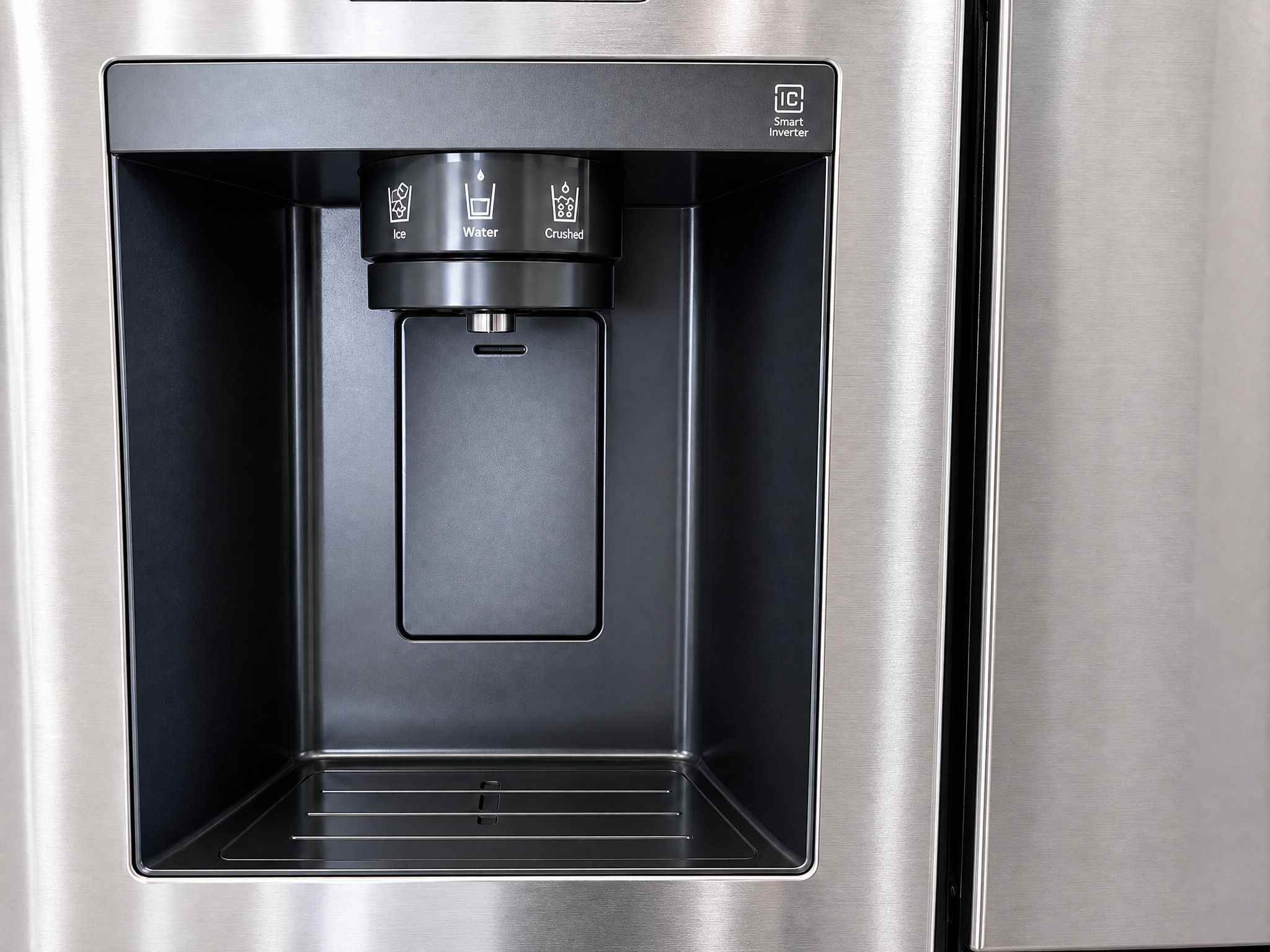 A water dispenser with options for ice, water, and crushed ice.