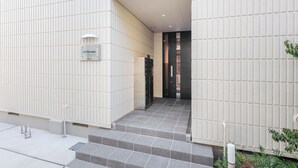 A modern building entrance with a sign reading "La Terrasse". - La Terrasse Higashikomagata by Tranova (Tokyo)