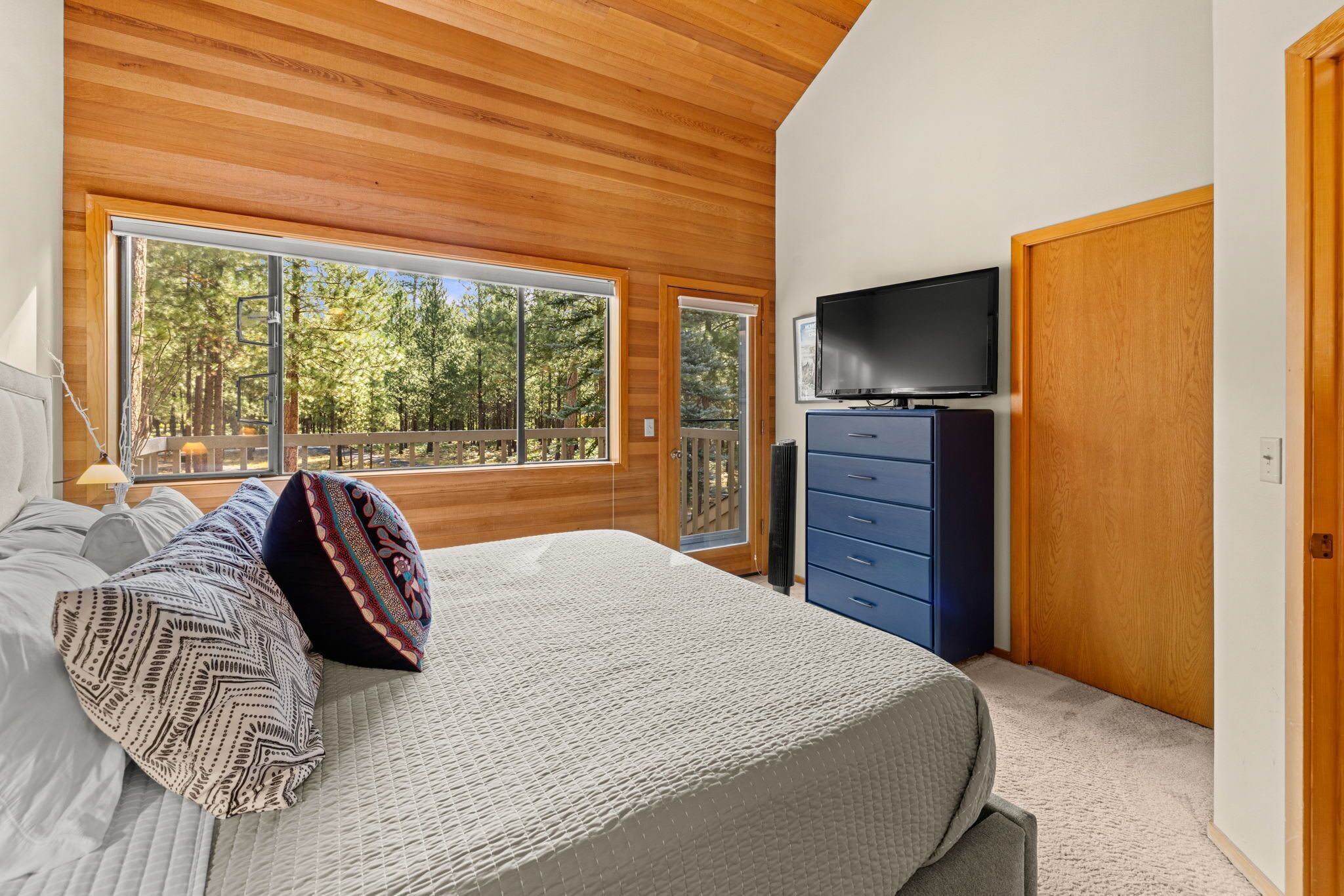 Upstairs King Bedroom. Vaulted Ceiling, Private Door to Bath, and Private Deck