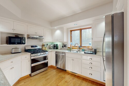 Lakefront home with private outdoor sauna, dock, firepit, wood fireplace & patio