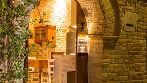 An arched stone structure with a sign reading 'Il Monastero.' - The Monastery - Unique Vacation Home (Monteprandone)