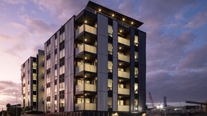 A multi-story building with balconies and large windows, likely a hotel or apartment complex. - Enfield Lux- Brand New Apartment (Auckland)