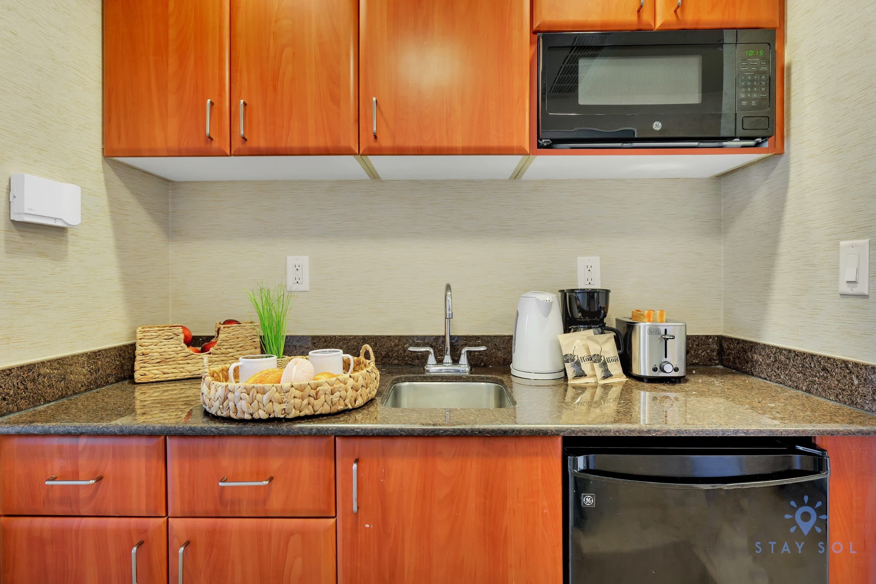 Coffee/tea maker, microwave, toaster, cookware/dishes/utensils