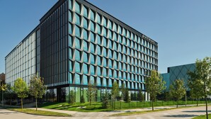 A modern building with a grid of windows and a sign reading "Pullman". - Pullman Zagreb (Zagreb)