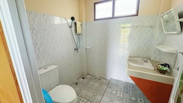 Bidet, towels, toilet paper