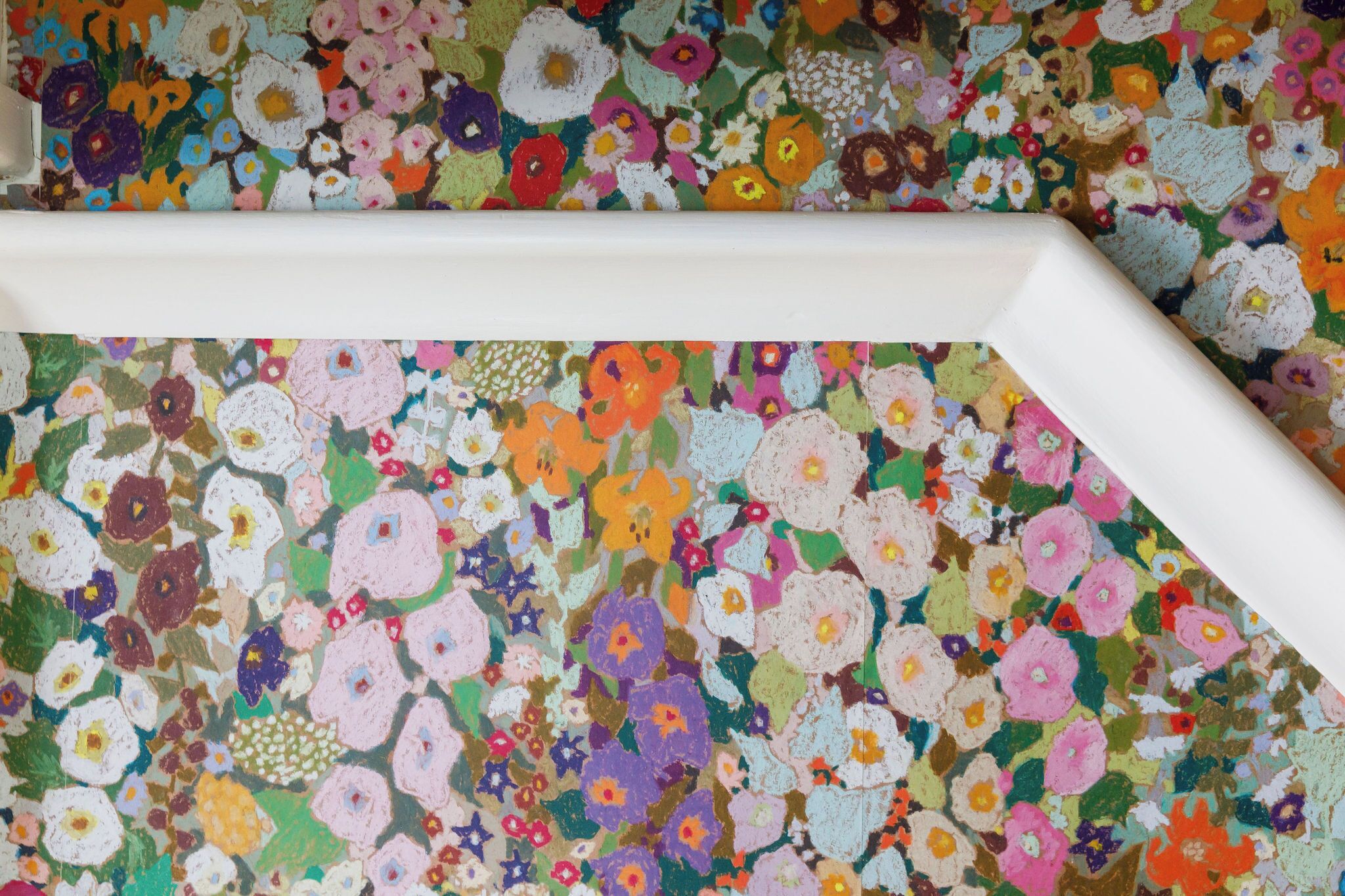 A colorful floral pattern on a wall.