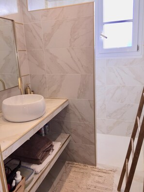 Shower, hair dryer, towels, soap