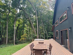 Outdoor dining - Serene and spacious home in the woods, w/ hot tub. Minutes from bike trails. (Deerwood)