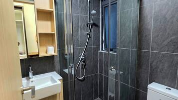 Shower, hair dryer, towels, soap