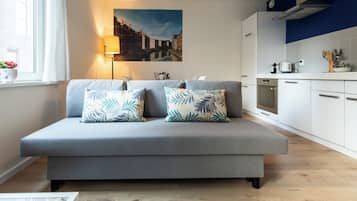 Family Apartment | Living area | 24-inch LCD TV with cable channels