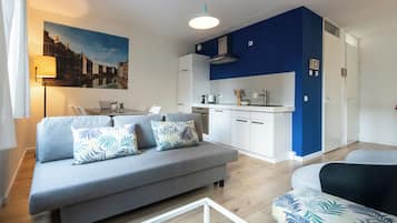 Family Apartment | Living area | 24-inch LCD TV with cable channels