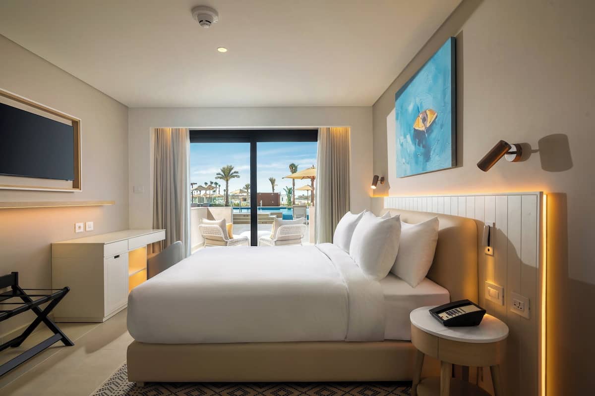 Suite, 1 Bedroom (Direct Pool Access) | Minibar, in-room safe, soundproofing, iron/ironing board