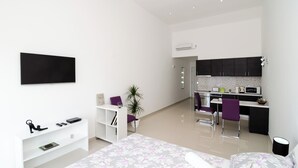 A modern apartment with a living area, a kitchen, and a dining space. - LUV Luxury Apartments (Dubrovnik)