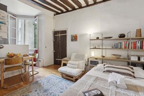 1 bedroom, desk, iron/ironing board, travel crib