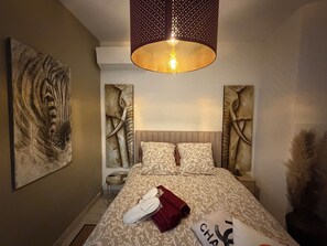 2 bedrooms, in-room safe, iron/ironing board, travel cot