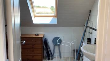 Shower, hair dryer, towels, toilet paper