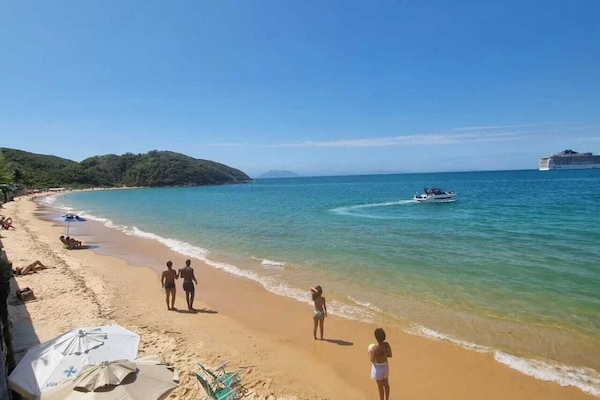 On the beach, white sand, beach umbrellas, beach bar
