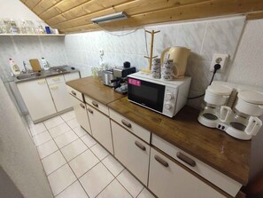 Fridge, microwave, stovetop, coffee/tea maker