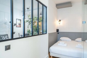 1 bedroom, desk, iron/ironing board, travel cot