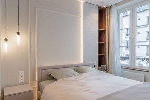 1 bedroom, desk, iron/ironing board, travel crib