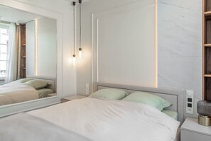 1 bedroom, desk, iron/ironing board, travel crib