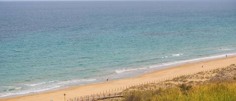 On the beach, sun-loungers, beach towels