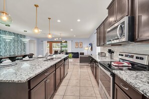 Fridge, microwave, oven, stovetop - EV_8884 - 8 Bed 6 Bath Villa with Screened Private Pool with Spillover Spa, Game (Kissimmee)