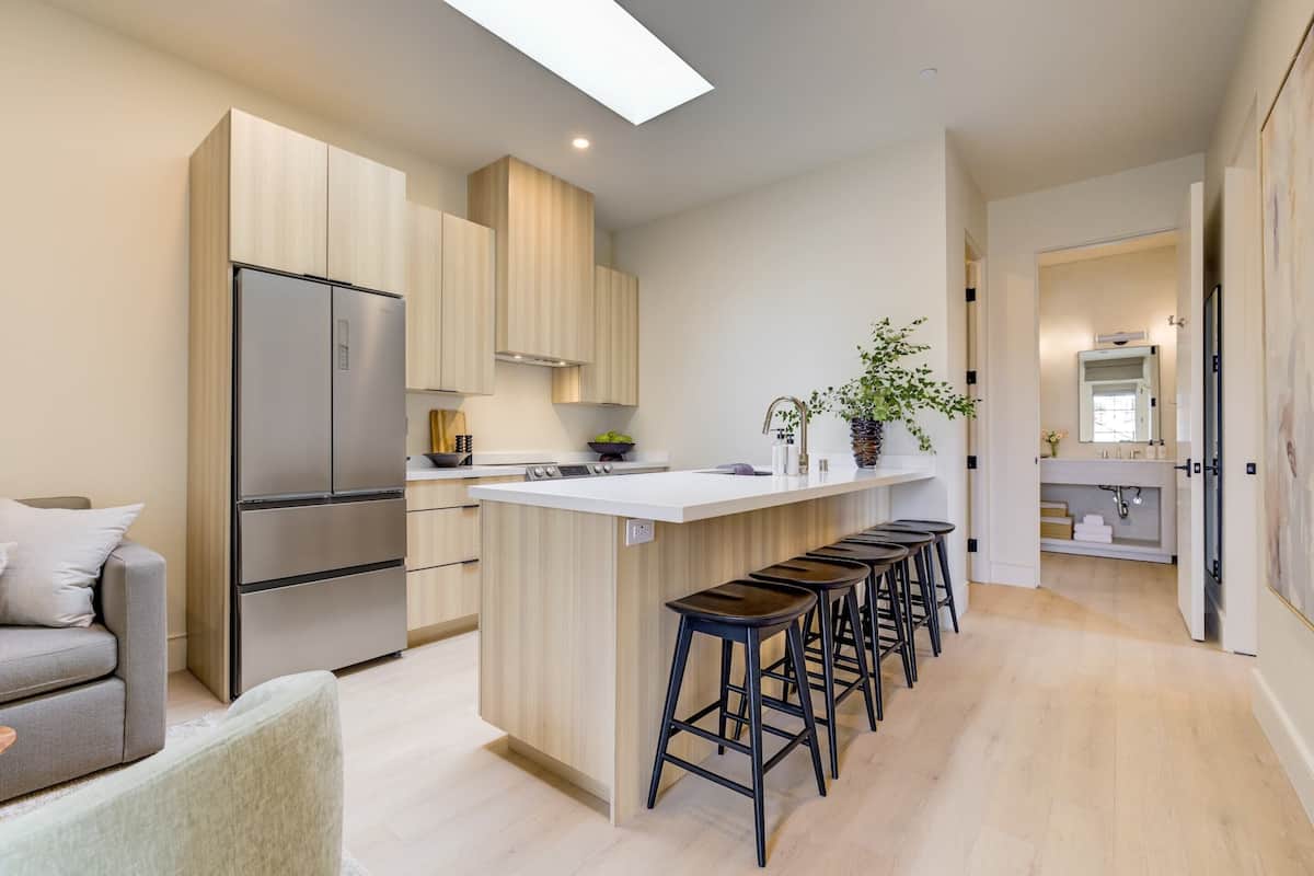 Enjoy cooking in this well-lit kitchen with a central island and large window above the sink.