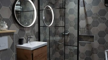 Shower, hair dryer, towels, soap