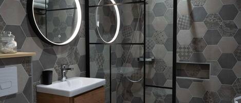 Shower, hair dryer, towels, soap