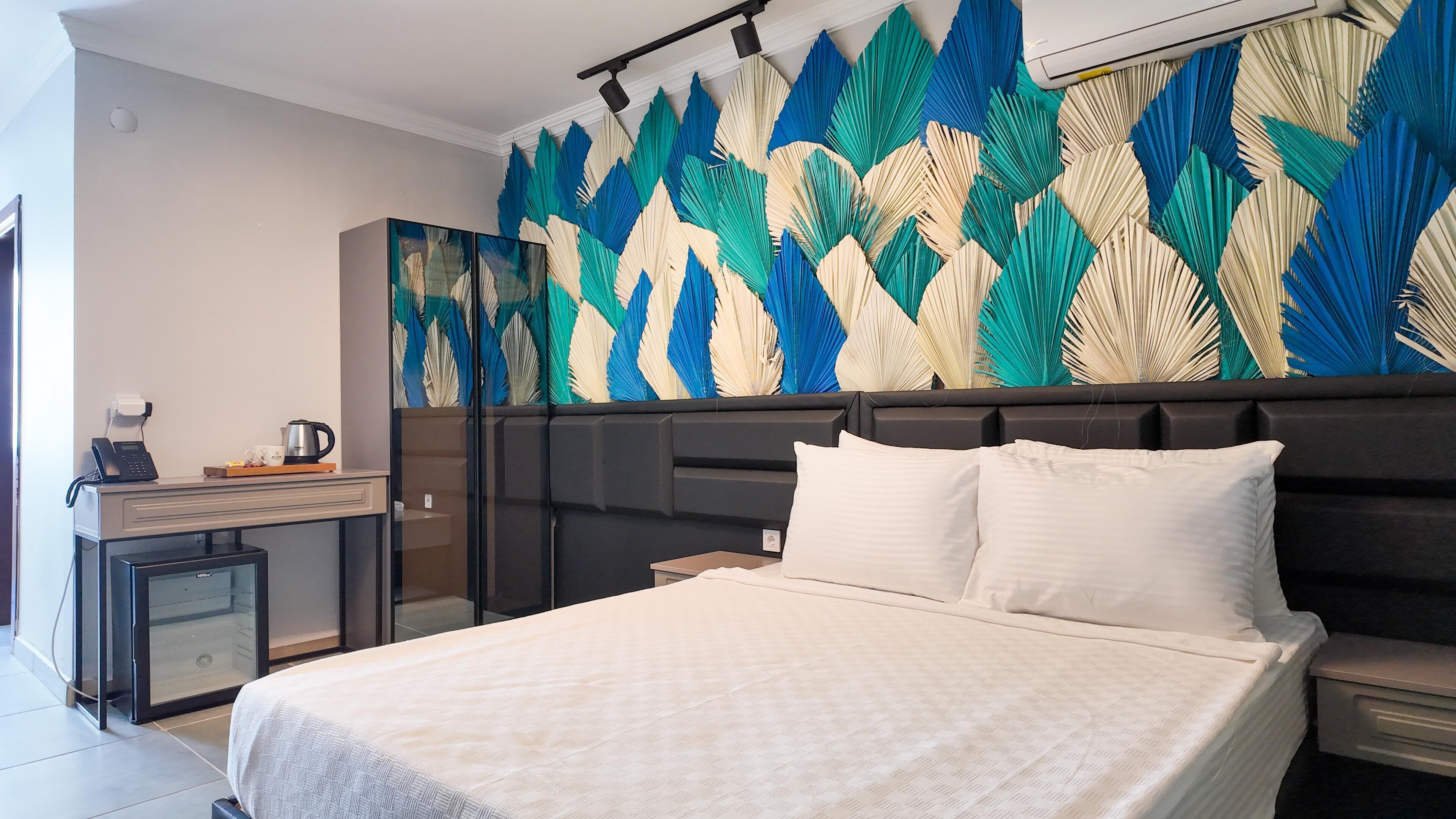 Standard Room | Free minibar items, individually furnished, desk, blackout drapes