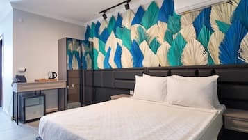 Standard Room | Free minibar items, individually furnished, desk, blackout drapes