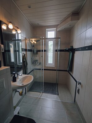 Shower, hair dryer, towels, soap