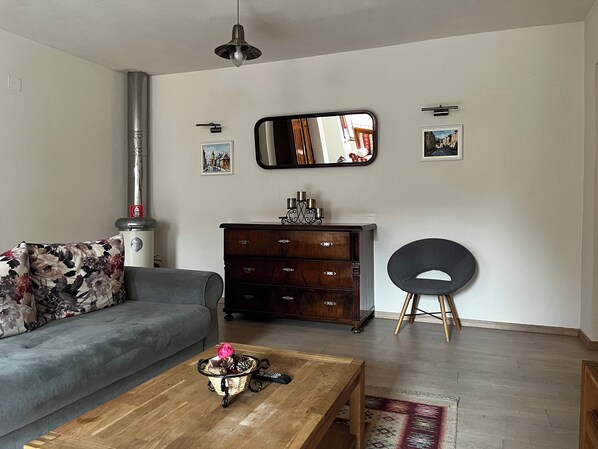 Cozy Apartment | Living area | 80-inch Smart TV with cable channels