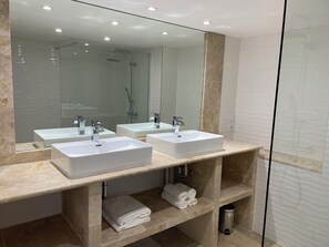 Shower, hair dryer, towels, toilet paper