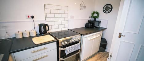 Fridge, microwave, toaster, cookware/dishes/utensils