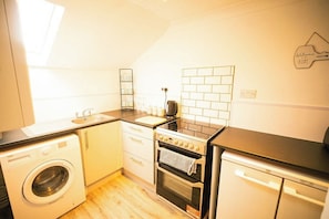 Fridge, microwave, toaster, cookware/dishes/utensils - Beachfront Bliss | Cozy Suite with Ocean Views (Suffolk)