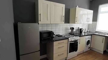 Fridge, microwave, toaster, cookware/dishes/utensils
