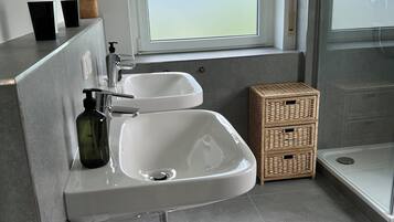 Shower, towels, soap, toilet paper