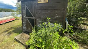 A small wooden shed labeled "FISH HSE." - Cabin 2 "Waterfall" 2 BR, 5-6 pp, access to boats! (Ely)
