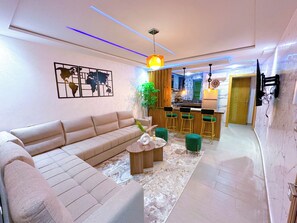 City Apartment, 2 Bedrooms, Balcony, Garden View | Living area | 65-inch Smart TV with satellite channels, Netflix, streaming services - VELUXA - Luxury Holiday Homes - Centric flat (Tangier)