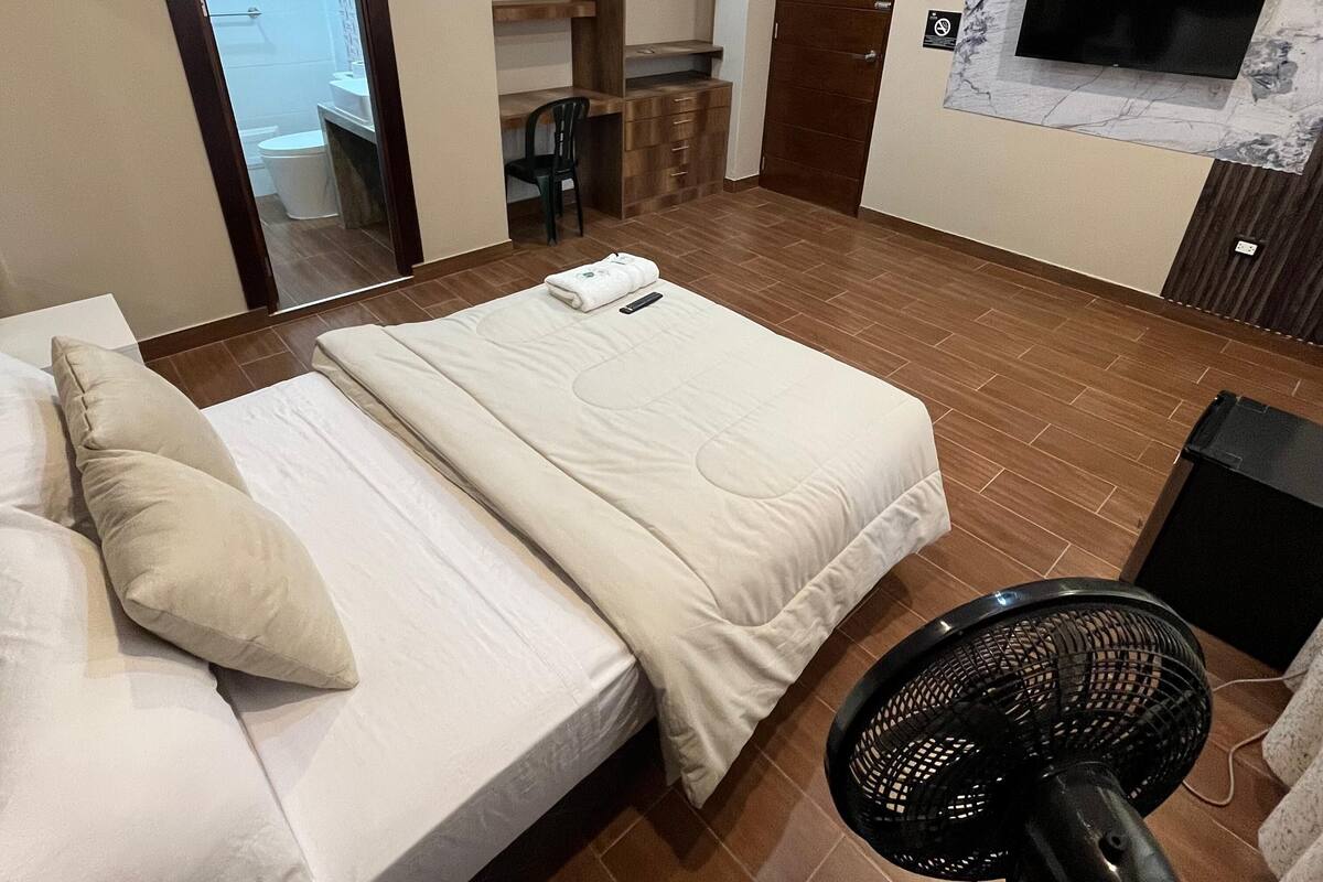 Premium bedding, down duvets, desk, laptop workspace