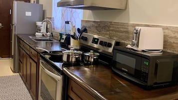 Fridge, microwave, stovetop, coffee/tea maker