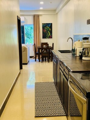 Fridge, microwave, stovetop, coffee/tea maker