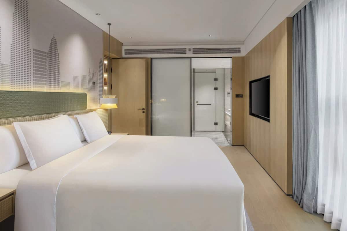 Premium bedding, down duvets, memory-foam beds, in-room safe